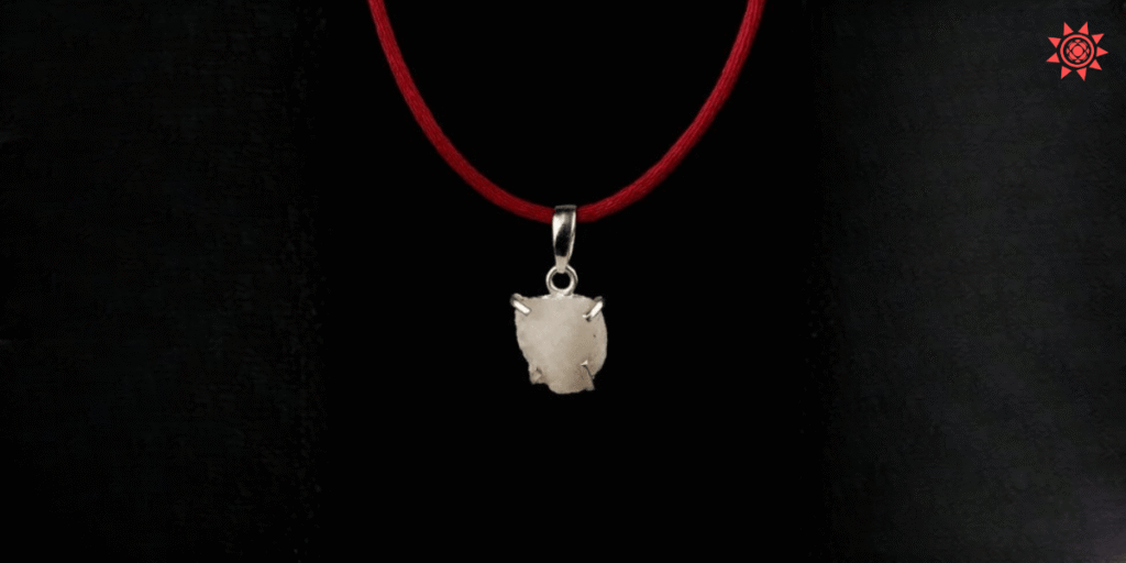 Machmani gemstone pendant with red thread necklace used in astrology for protection and spiritual energy