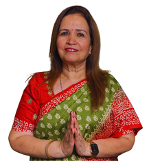 Woman in a red and green sari smiling while pressing palms together in a namaste gesture (greeting).